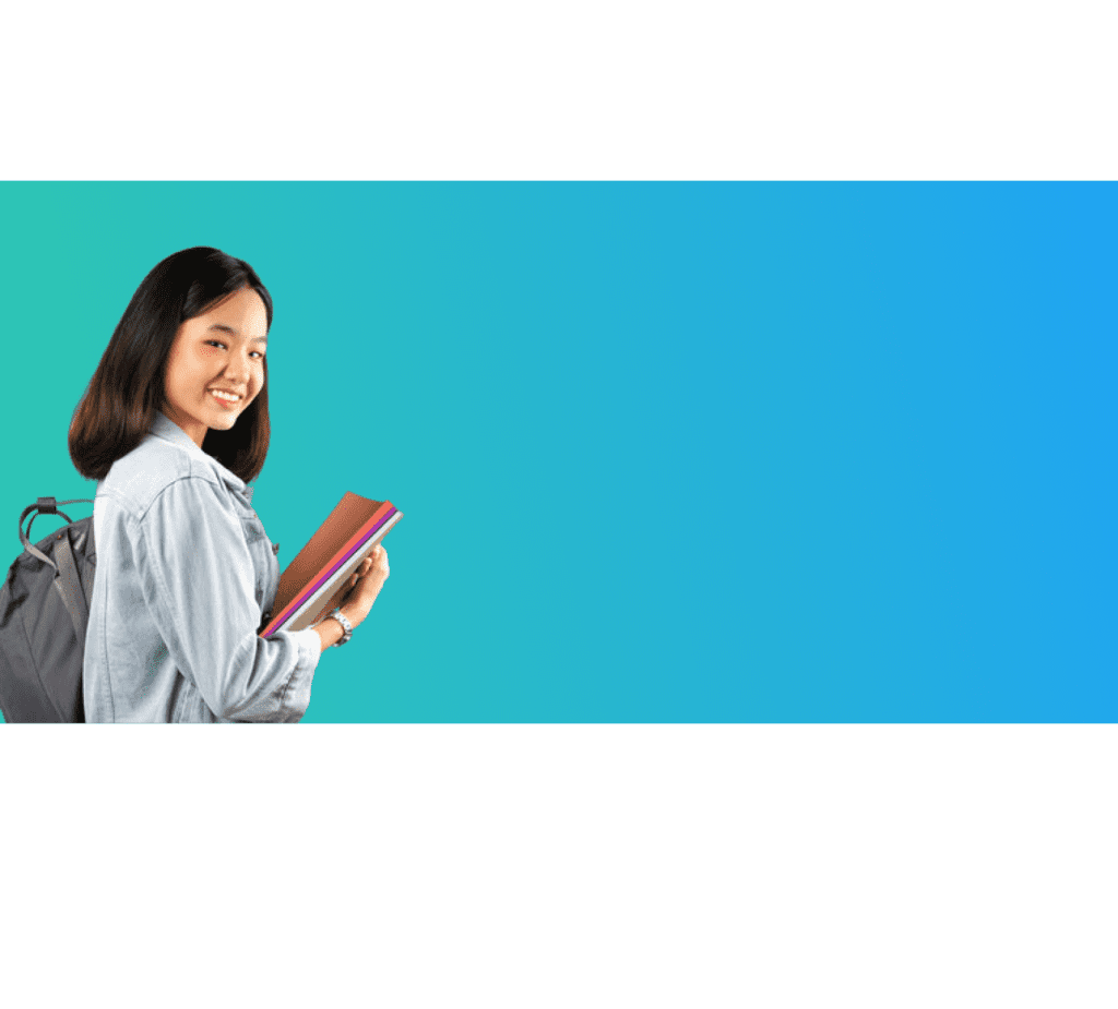 A girl holding a book and smiling for the camera.