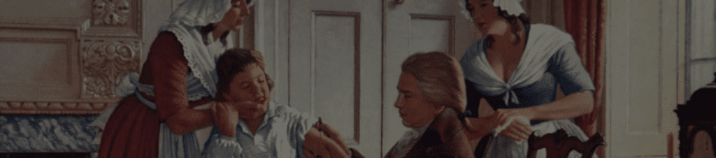 A woman is looking at her phone in the mirror.