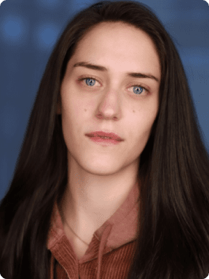 A woman with long hair and blue eyes.