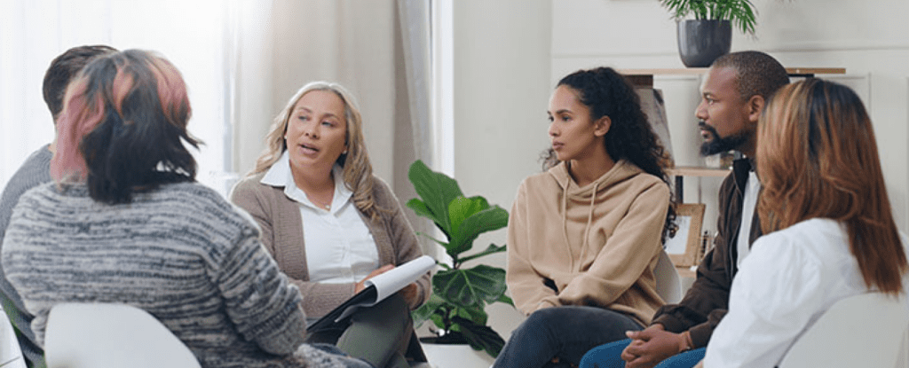 A group of people sitting in a circle.