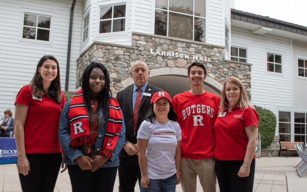 A group of people standing in front of a building.