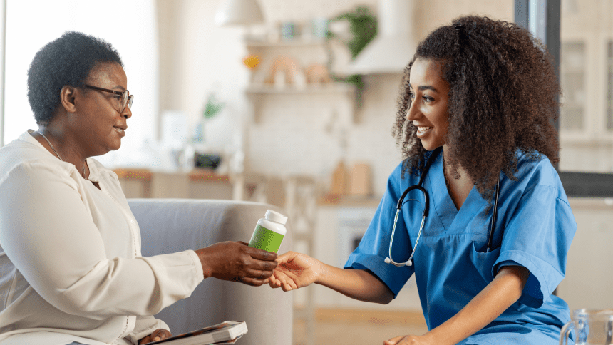A woman shaking hands with a doctor holding a jar.