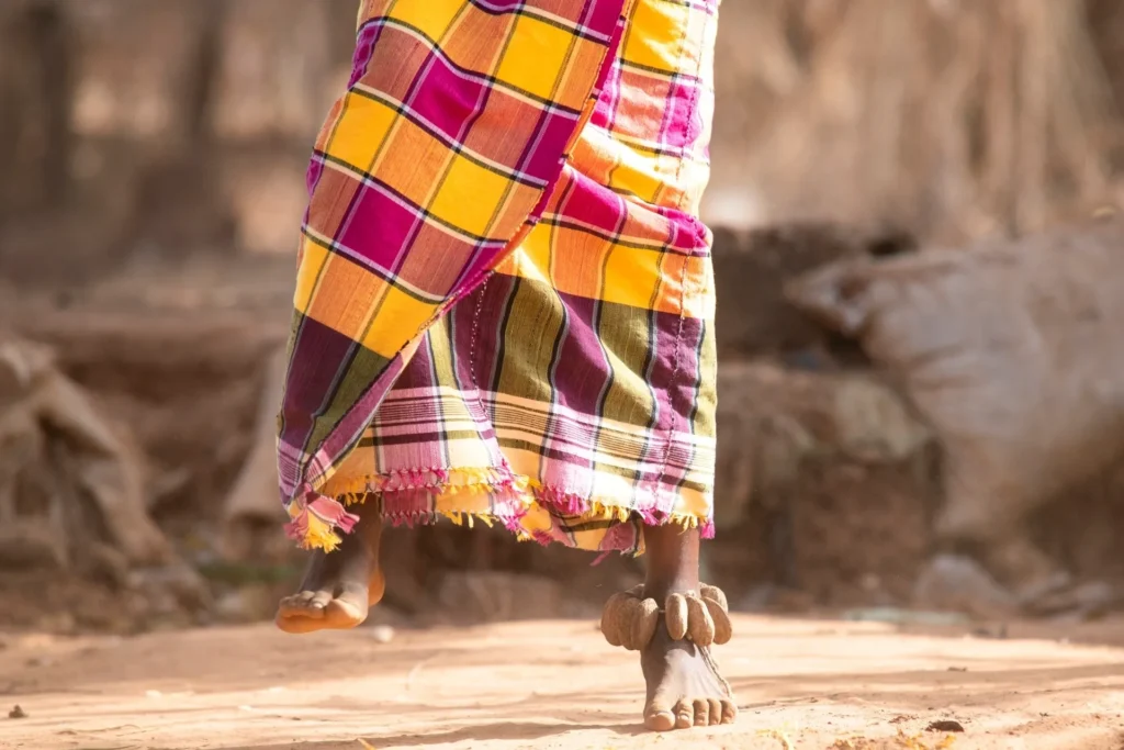 Colorful patterned fabric and beaded anklets.